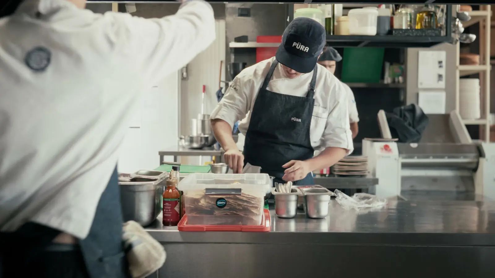 Püra chef plating in the kitchen