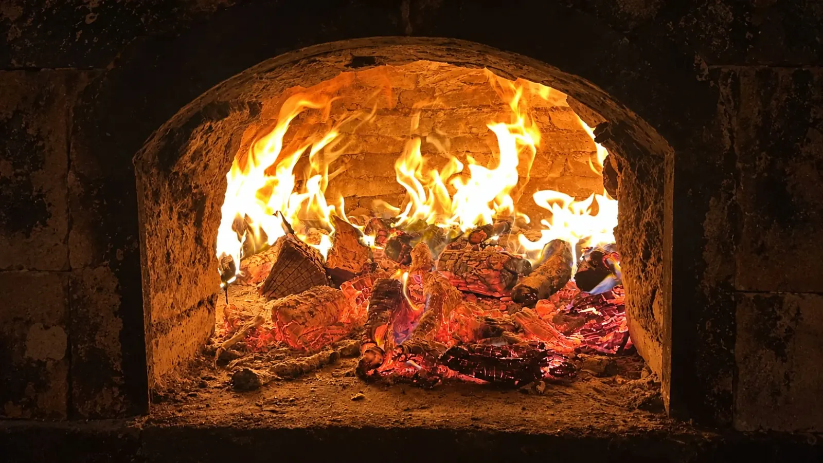 Clay oven fired up with wood and embers